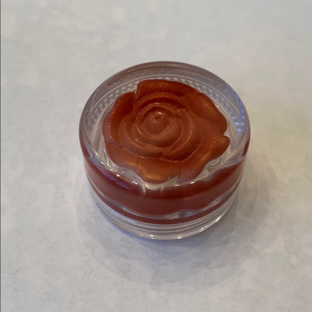 Pumpkin color lipgloss in flower box Cute